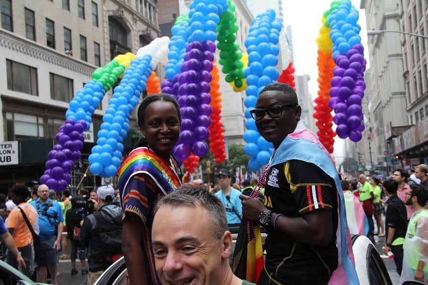 Pepe Julian Onziema (right) from Sexual Minorities Uganda leads the parade, along with fellow Ugandan activist and 2015 Pride Grand Marshal Kasha Jacqueline Nabagesera (left).
